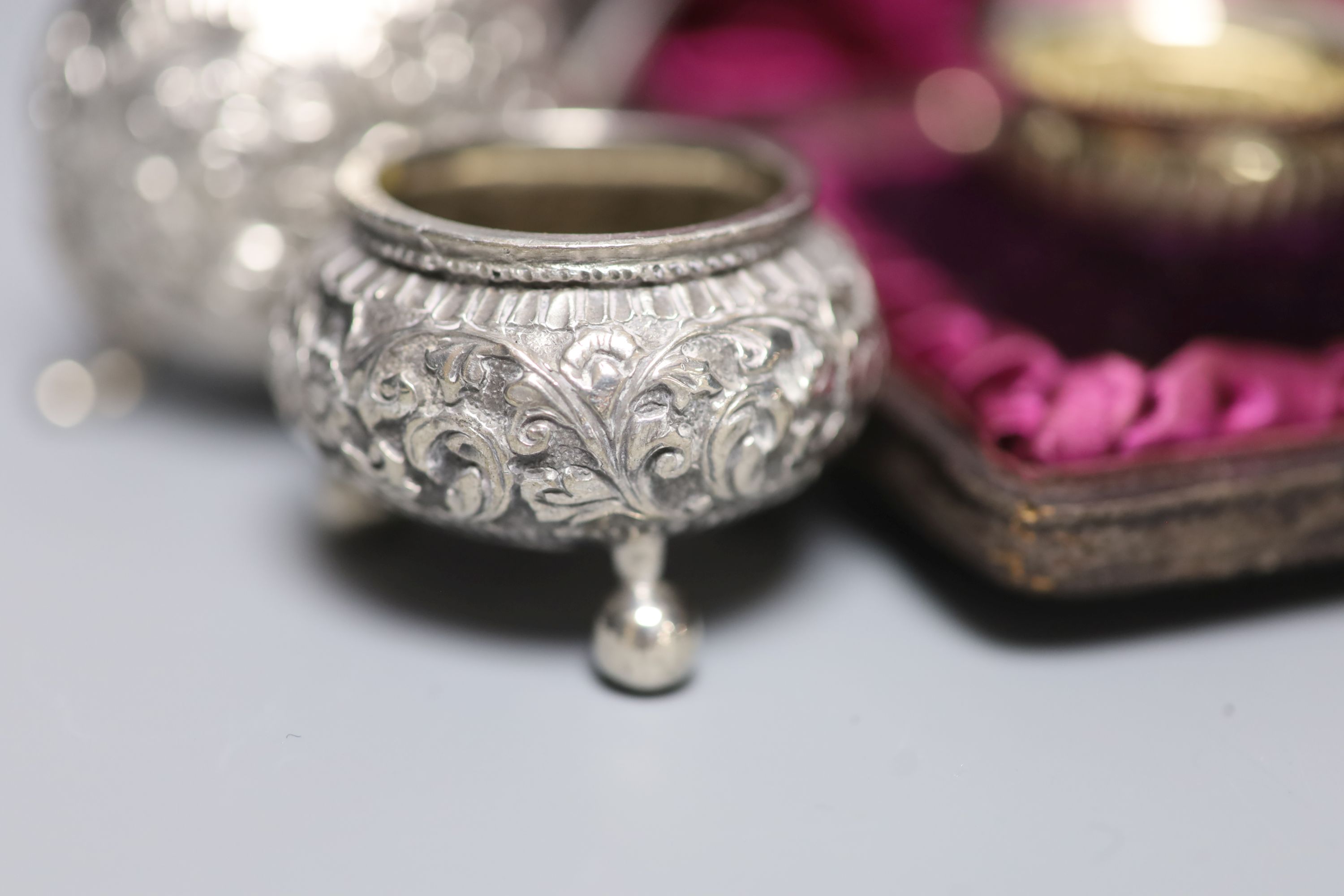 A group of small silverware, including Edwardian tobacco box, London, 1902, a cased pair of salts and a menu holder and other white metal items including Indian.